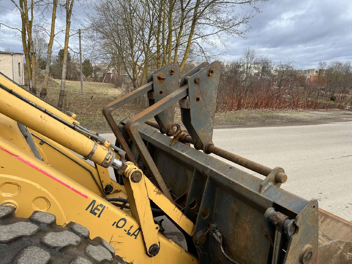 New Holland LB 115, excavator loader