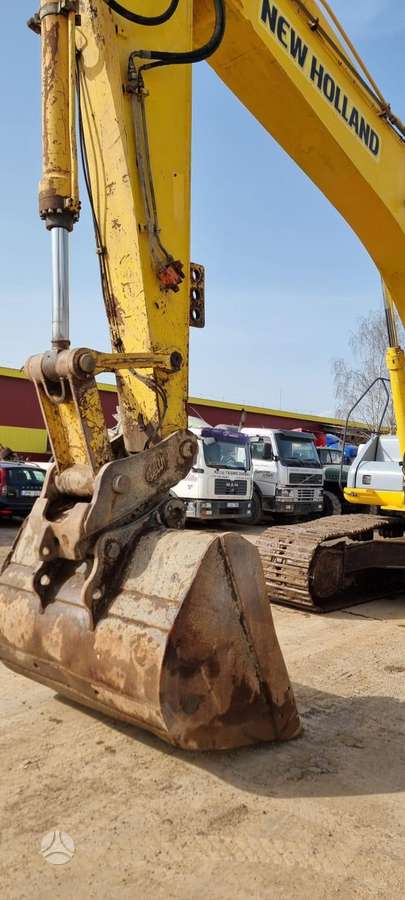 New Holland E 385, экскаваторы