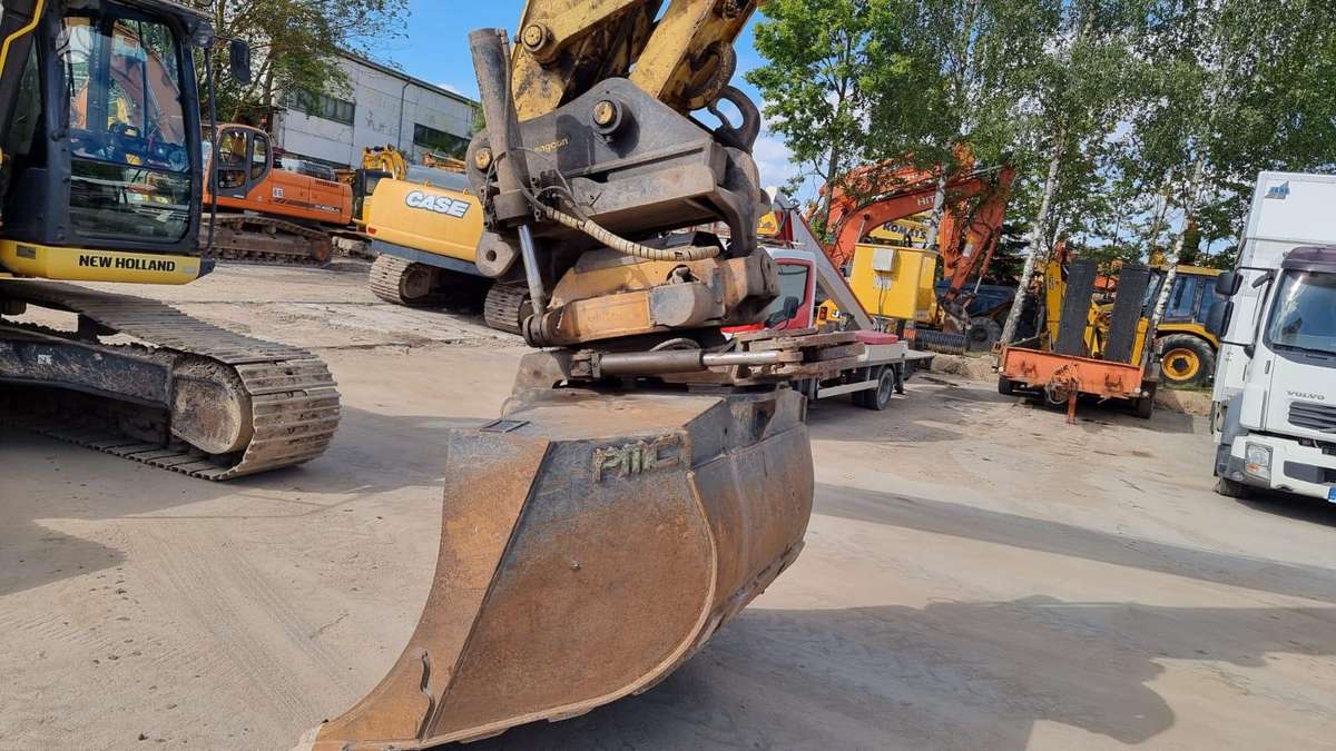 New Holland E 265 C Rototilt, экскаваторы