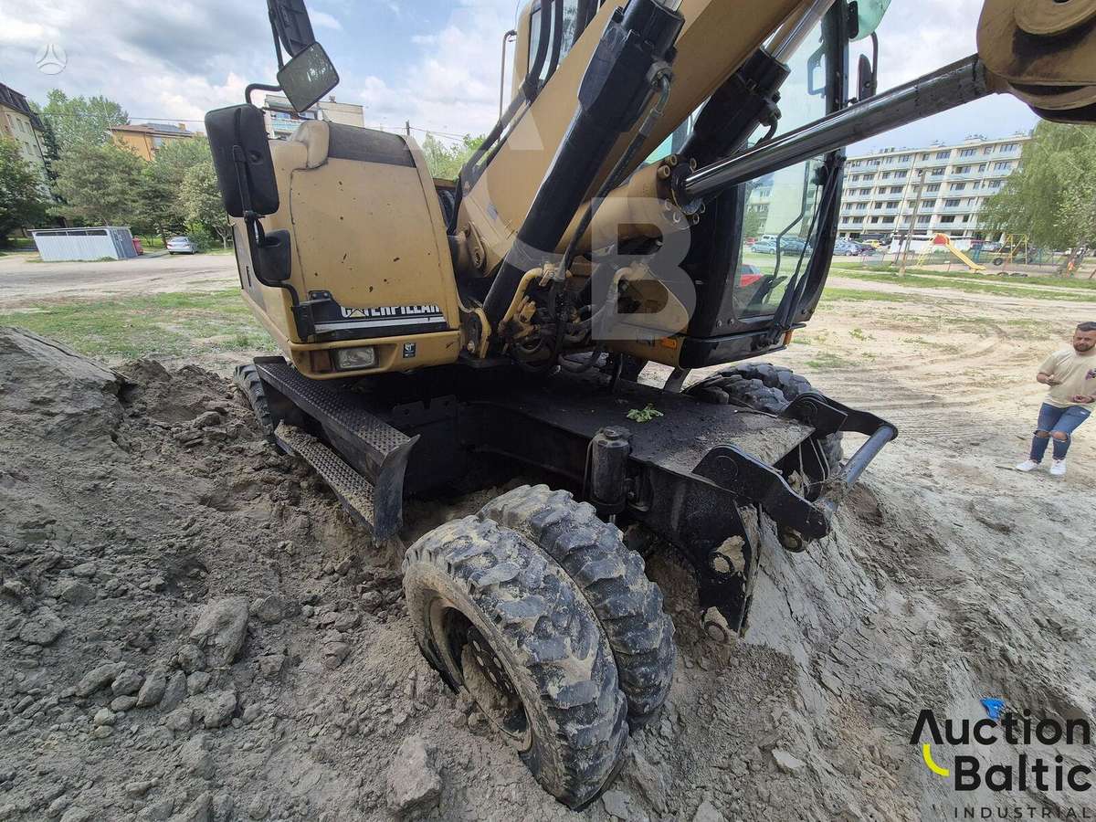 Caterpillar M 318 C, экскаваторы