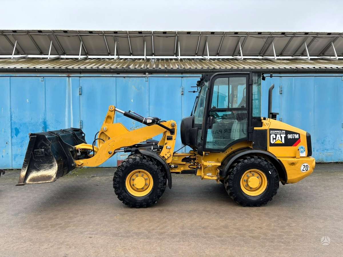 Caterpillar 907M, фронтальные погрузчики