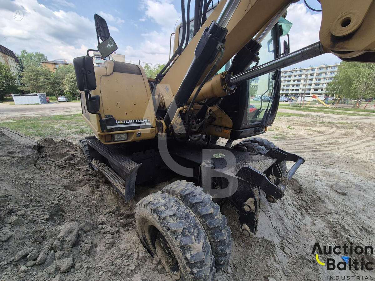 Caterpillar M 318 C, экскаваторы