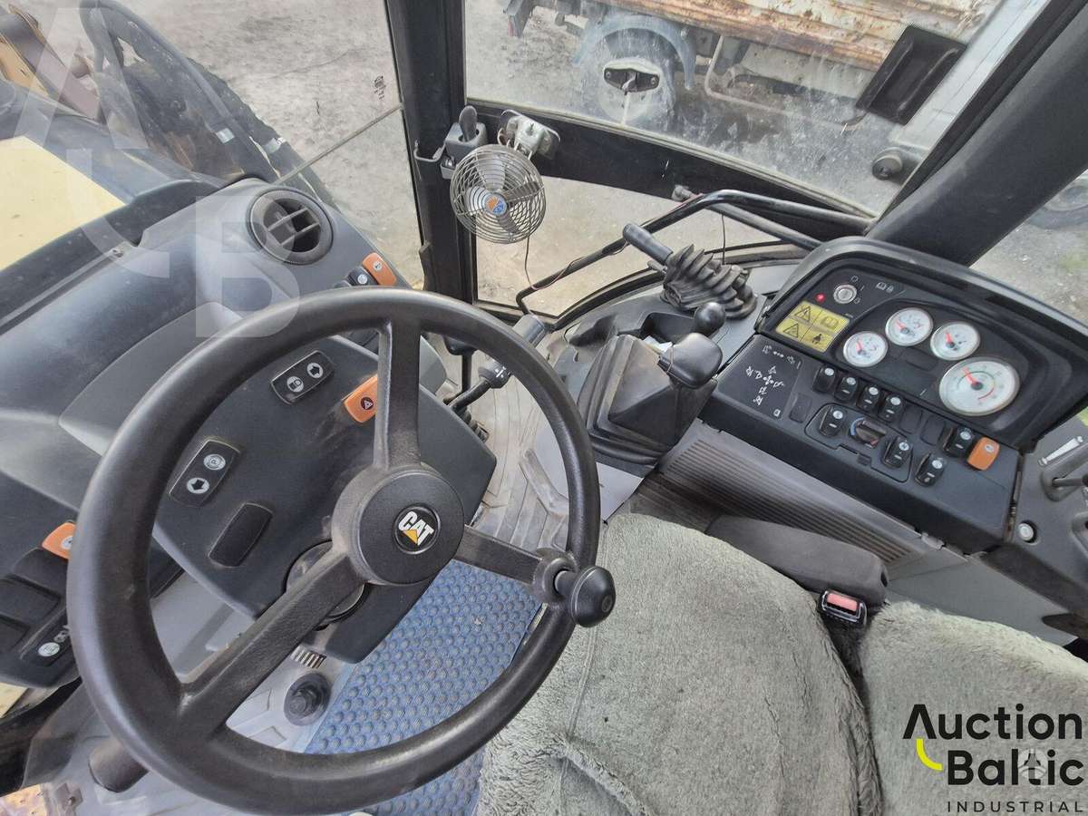 Caterpillar 428 E, экскаваторные погрузчики