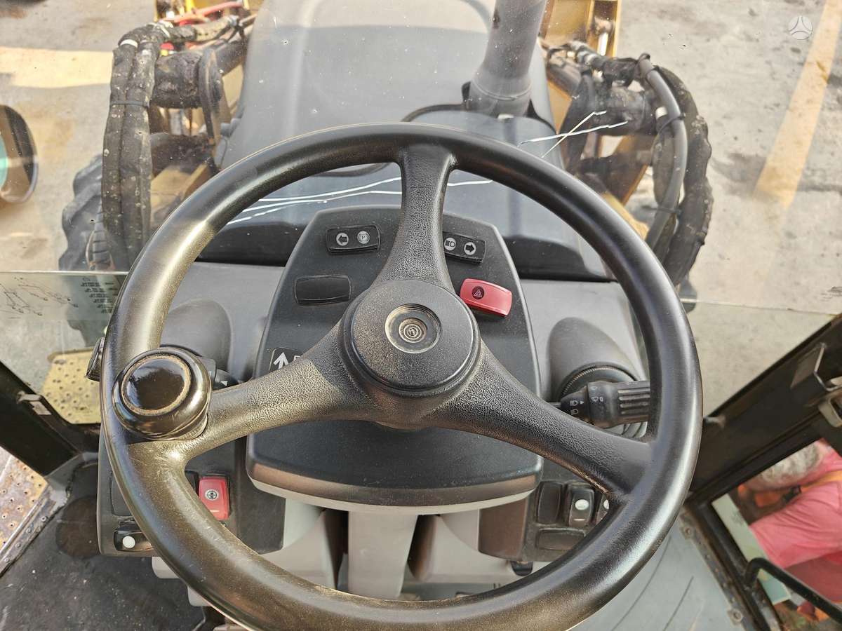Caterpillar 428E, экскаваторные погрузчики